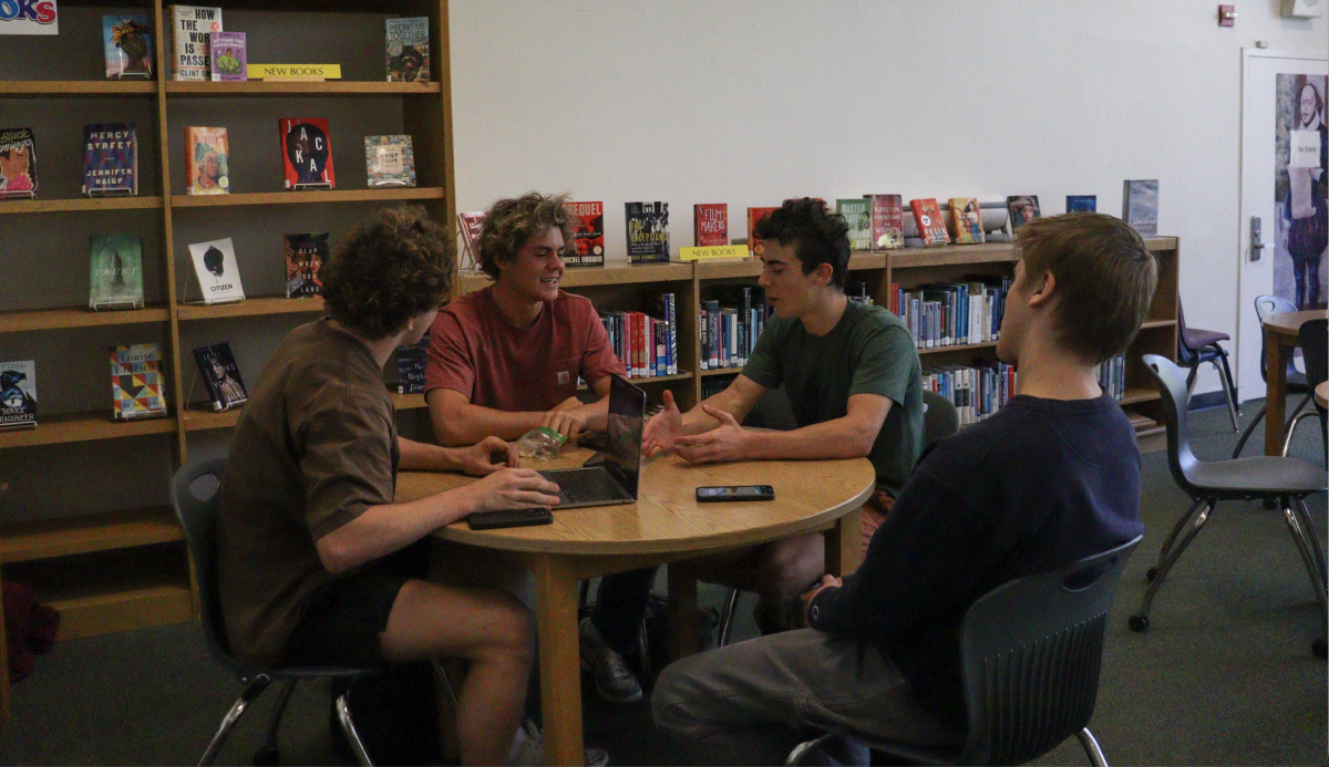 Co-founder Ben Borgeson leads a Key Club meeting in the library.